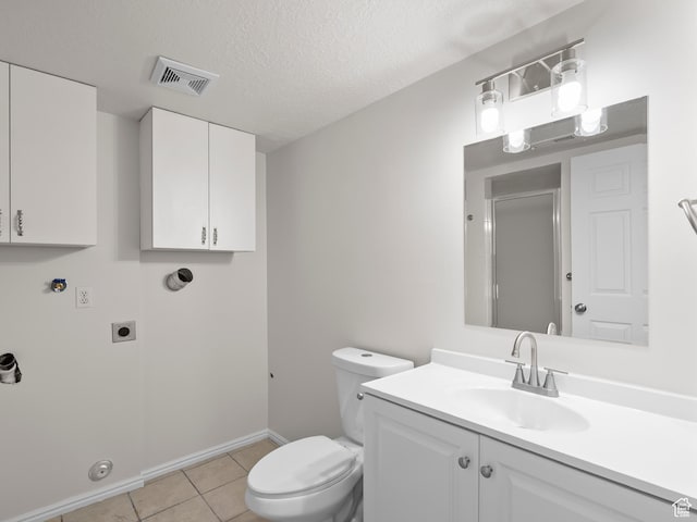bathroom featuring toilet, tile patterned flooring, an enclosed shower, vanity, and baseboards
