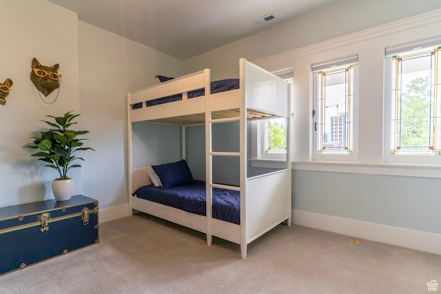 158 N State St, Salt Lake City, UT 84103 - bedroom with multiple windows, carpet flooring, and baseboards