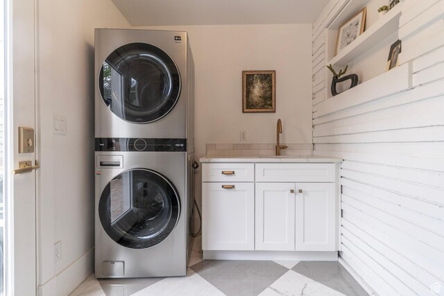 158 N State St, Salt Lake City, UT 84103 - clothes washing area with stacked washing machine and dryer and cabinet space