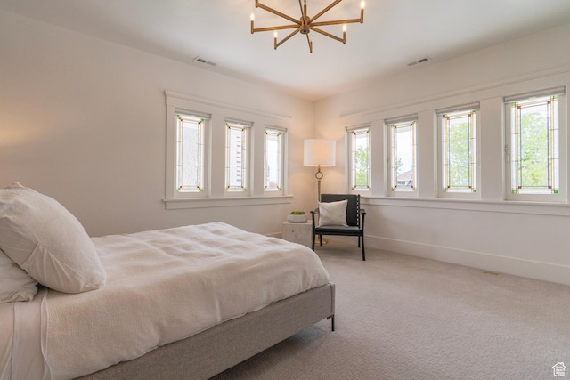 158 N State St, Salt Lake City, UT 84103 - carpeted bedroom with a chandelier and baseboards