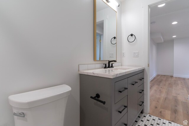 158 N State St, Salt Lake City, UT 84103 - bathroom with recessed lighting, vanity, wood finished floors, and toilet