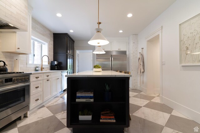 158 N State St, Salt Lake City, UT 84103 - kitchen featuring stainless steel appliances, backsplash, recessed lighting, white cabinets, and a sink