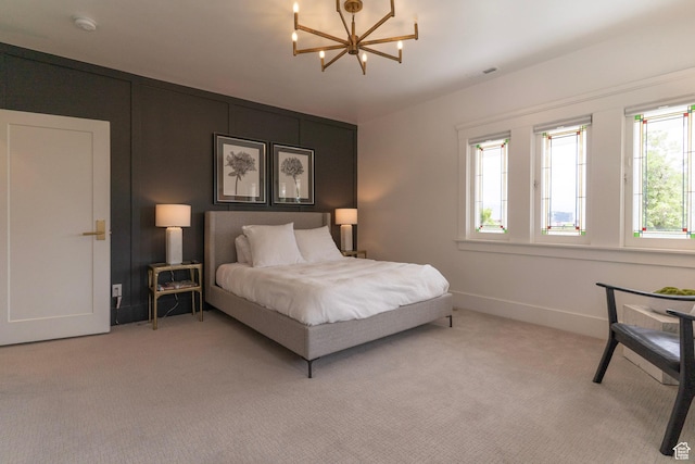 158 N State St, Salt Lake City, UT 84103 - bedroom with a chandelier, light carpet, and baseboards