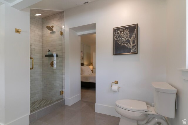 158 N State St, Salt Lake City, UT 84103 - ensuite bathroom featuring toilet, a stall shower, baseboards, and tile patterned flooring
