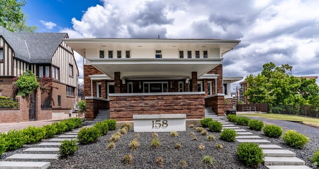158 N State St, Salt Lake City, UT 84103 - view of front facade with stairs, fence, and brick siding