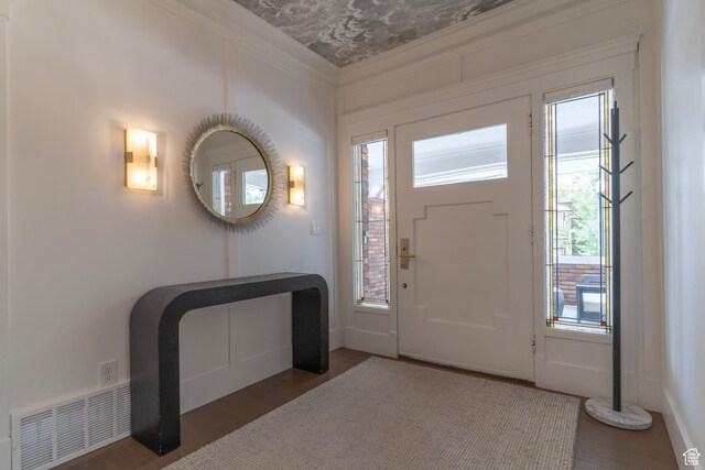158 N State St, Salt Lake City, UT 84103 - entryway with healthy amount of natural light, wood finished floors, ornamental molding, and baseboards
