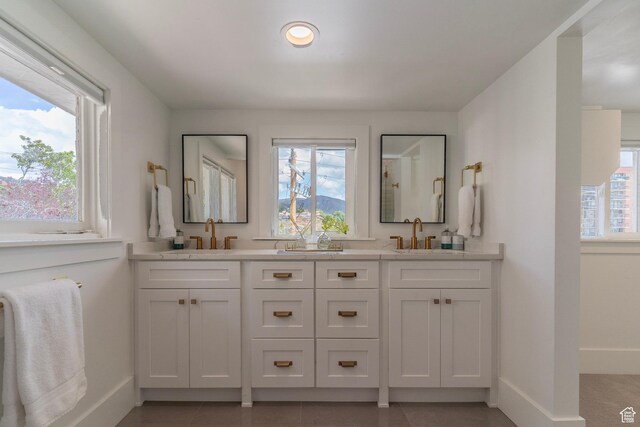 158 N State St, Salt Lake City, UT 84103 - full bathroom with baseboards, double vanity, recessed lighting, and tile patterned floors