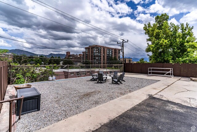 158 N State St, Salt Lake City, UT 84103 - view of patio / terrace featuring a mountain view and fence
