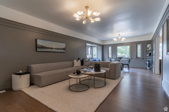 158 N State St, Salt Lake City, UT 84103 - living room with a chandelier, wood finished floors, and baseboards