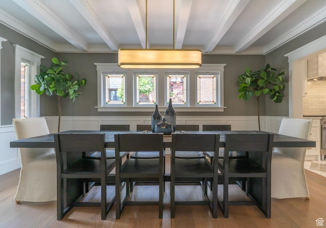 158 N State St, Salt Lake City, UT 84103 - dining area featuring beam ceiling, healthy amount of natural light, wood finished floors, a wainscoted wall, and crown molding