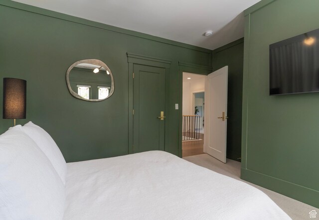 158 N State St, Salt Lake City, UT 84103 - carpeted bedroom featuring baseboards