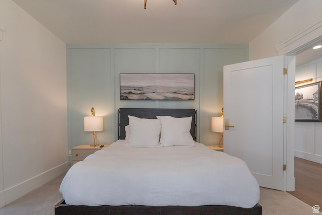 158 N State St, Salt Lake City, UT 84103 - bedroom featuring a decorative wall and baseboards