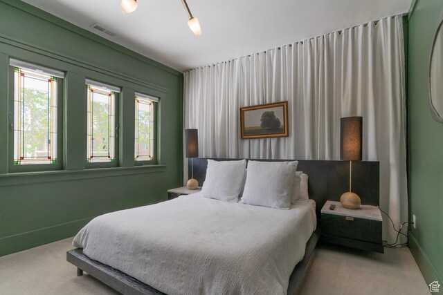 158 N State St, Salt Lake City, UT 84103 - bedroom with carpet flooring, multiple windows, and baseboards