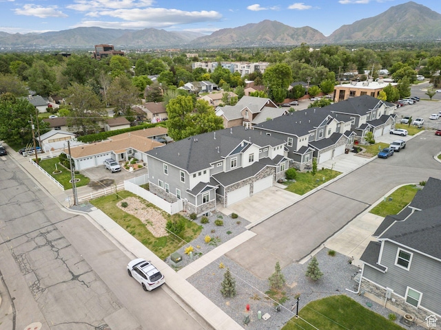 aerial view of residential area featuring a mountainous background