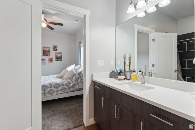 bathroom featuring vanity, ceiling fan, and ensuite bathroom