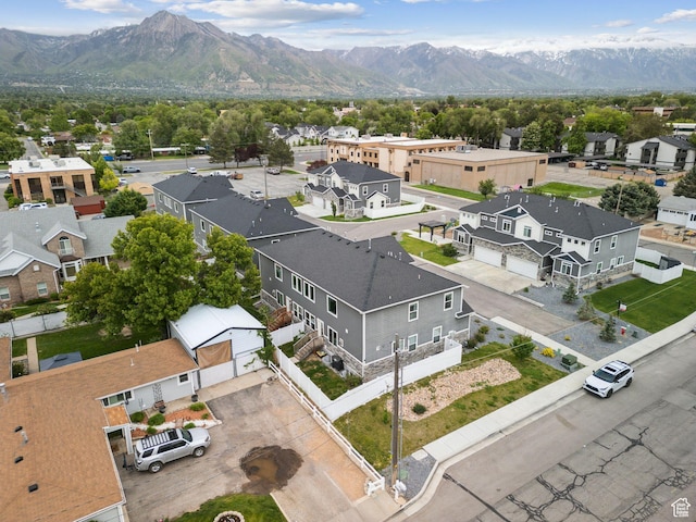 aerial perspective of suburban area featuring a mountain backdrop