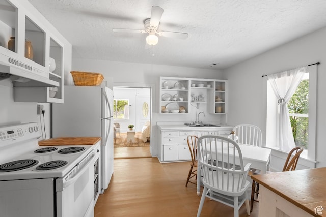 kitchen featuring electric range, open shelves, a sink, a textured ceiling, and a ceiling fan