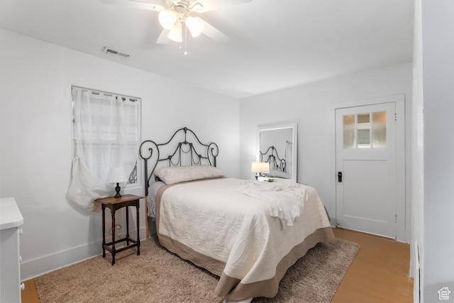 bedroom featuring wood finished floors and ceiling fan