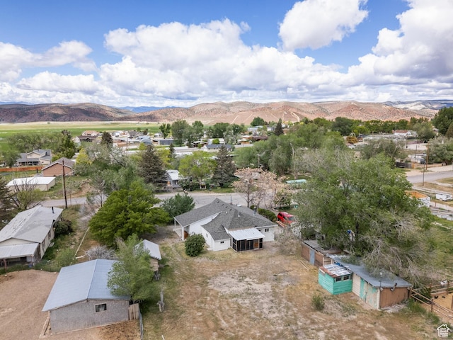 aerial perspective of suburban area with a mountainous background