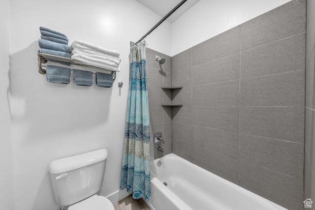 bathroom with shower / tub combo with curtain, toilet, and wood finished floors
