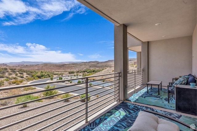 balcony featuring a mountain view