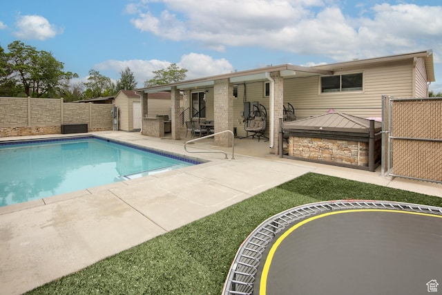 view of pool with a patio area and a fenced backyard