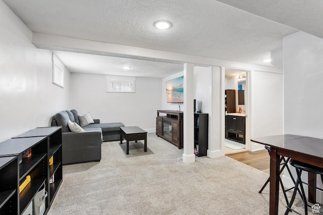 445 E Swenson Ave S, Springville, UT 84663 - living area featuring carpet floors, a textured ceiling, a glass covered fireplace, and recessed lighting