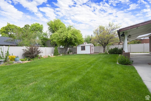 view of yard featuring a shed and an outbuilding