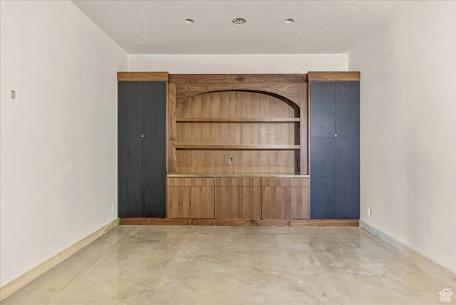 6078 S Heughs Canyon Way, Holladay, UT 84121 - unfurnished room with finished concrete flooring and baseboards