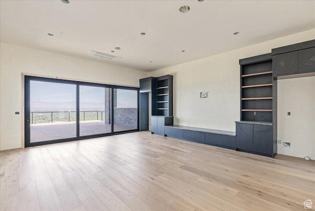 6078 S Heughs Canyon Way, Holladay, UT 84121 - unfurnished living room with light wood-style floors and recessed lighting