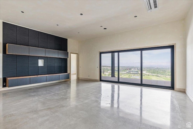 6078 S Heughs Canyon Way, Holladay, UT 84121 - unfurnished room featuring concrete floors, baseboards, and a towering ceiling