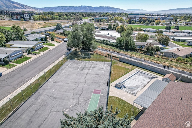 aerial view of residential area featuring mountains