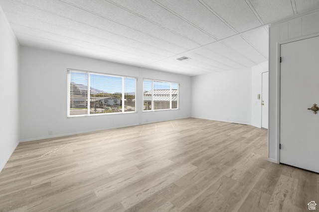 unfurnished room featuring light wood-type flooring