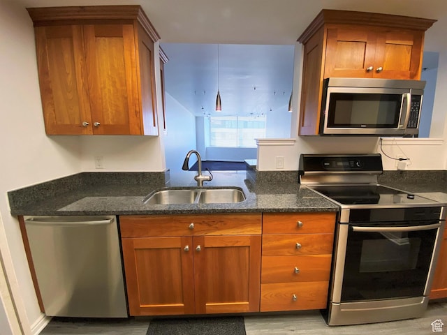 48 W Broadway Unit 1804N, Salt Lake City, UT 84101 - kitchen with stainless steel appliances, a sink, and brown cabinets