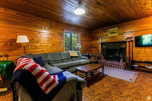 living room featuring wood walls, a brick fireplace, and wooden ceiling