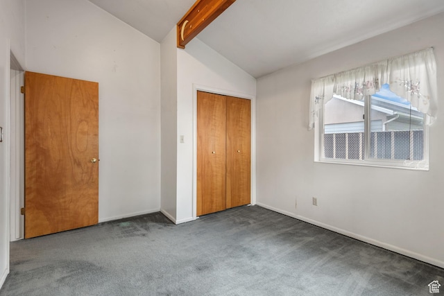 unfurnished bedroom featuring carpet, baseboards, and a closet