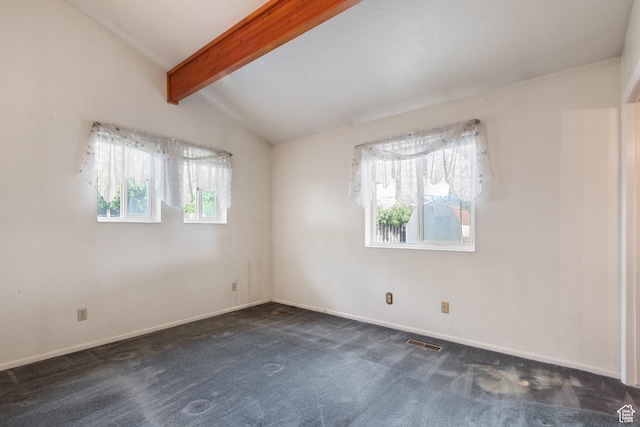 unfurnished room with dark colored carpet and baseboards