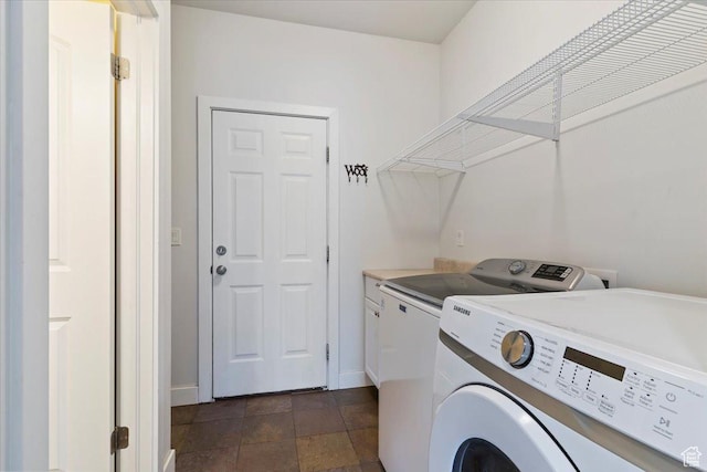 4026 E 4325 N, Eden, UT 84310 - laundry room with washer and dryer, baseboards, cabinet space, and dark stone finish flooring