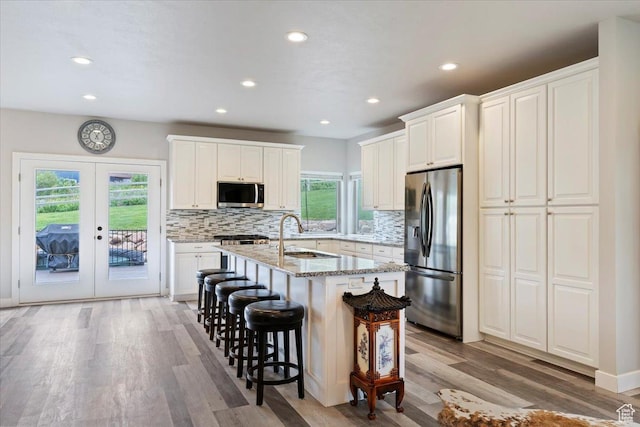 4026 E 4325 N, Eden, UT 84310 - kitchen featuring stainless steel appliances, a sink, healthy amount of natural light, light wood-style flooring, and recessed lighting