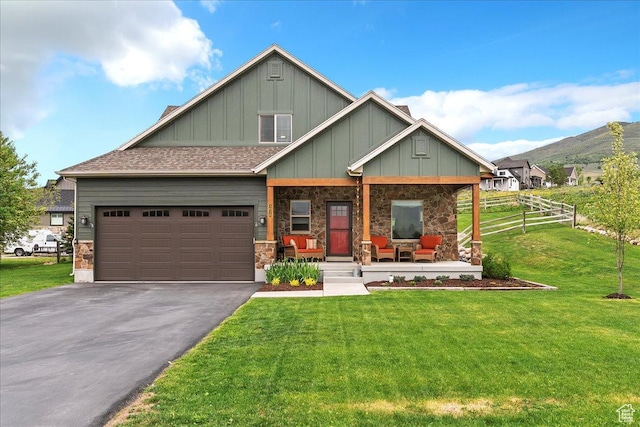 4026 E 4325 N, Eden, UT 84310 - craftsman-style home with board and batten siding, a porch, asphalt driveway, and a mountain view
