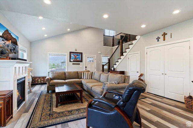 4026 E 4325 N, Eden, UT 84310 - living room with wood finished floors, stairway, recessed lighting, high vaulted ceiling, and a glass covered fireplace