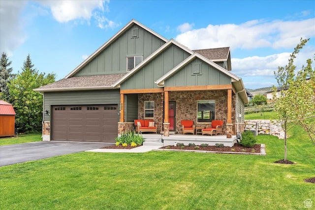 4026 E 4325 N, Eden, UT 84310 - craftsman inspired home featuring a porch, board and batten siding, driveway, an attached garage, and a front lawn