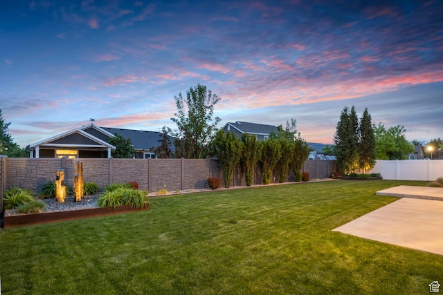 yard at dusk with a patio