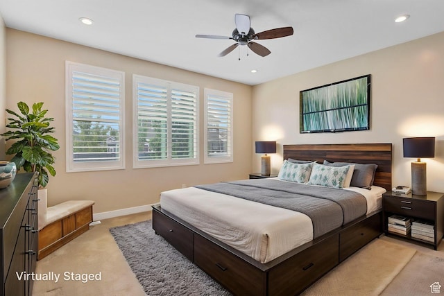 bedroom featuring light colored carpet, baseboards, recessed lighting, and ceiling fan