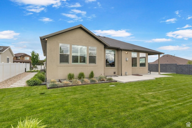 rear view of property with a patio area and stucco siding
