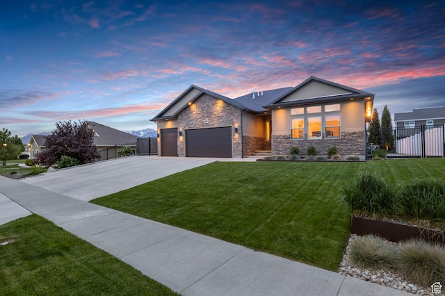 view of front of home with stone siding, a garage, concrete driveway, and stucco siding