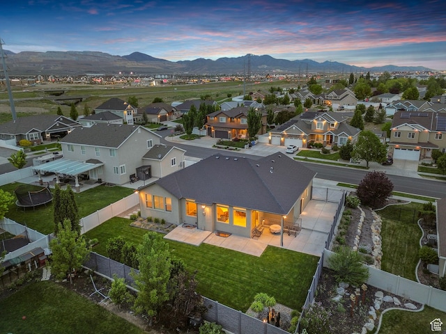 aerial view of residential area featuring a mountain backdrop