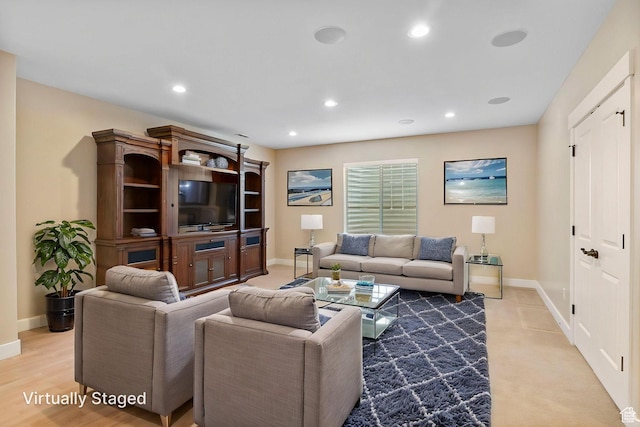 living room with baseboards and recessed lighting