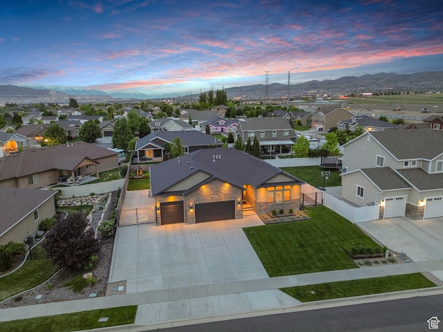 aerial view at dusk of a residential view and a mountain view