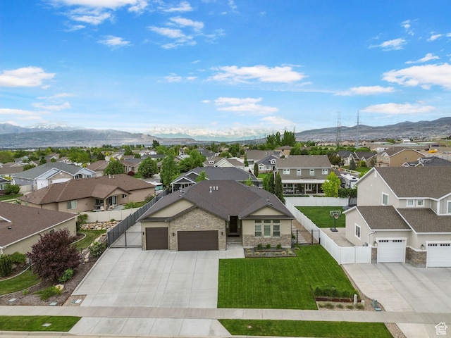 aerial perspective of suburban area featuring a mountain backdrop